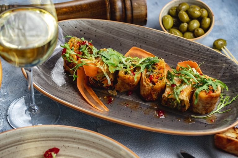 A vibrant platter of grilled chicken kabobs, basmati rice, and fresh hummus representing elite mediterranean food westside la.