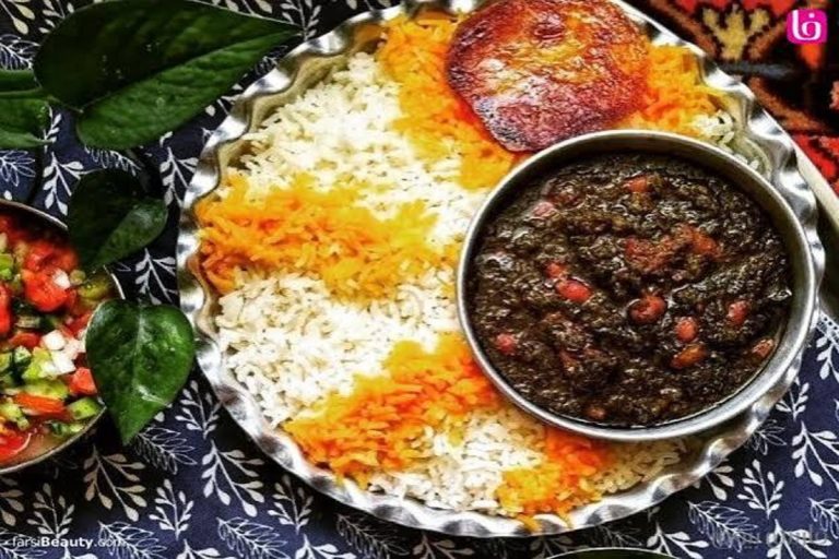 Bowl of slow-cooked Ghormeh Sabzi beef stew served with saffron basmati rice at a ghormeh sabzi restaurant in Moorpark.